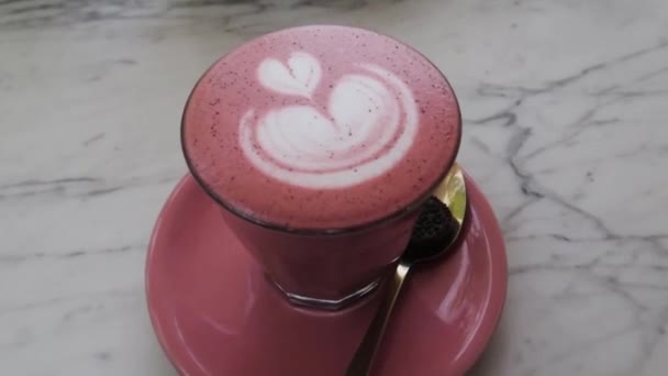 Cup Pink Chai Latte Art Golden Spoon — Stockvideo