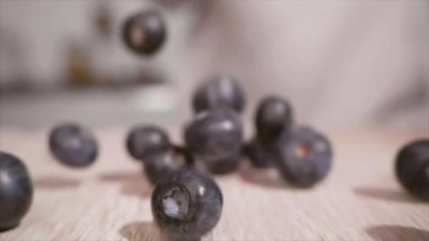 Woman Hand Throws Blueberry Fruit Table Kitchen Close Slow Motion — 비디오