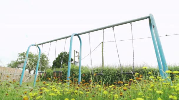 Empty Swings Abandoned Children Playground Overgrown Grass Covid Pandemic — Stock videók