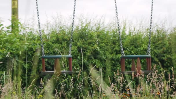 Children Swings Public Playground Deserted Grey Cloudy Day Eerie Mood — Stock videók