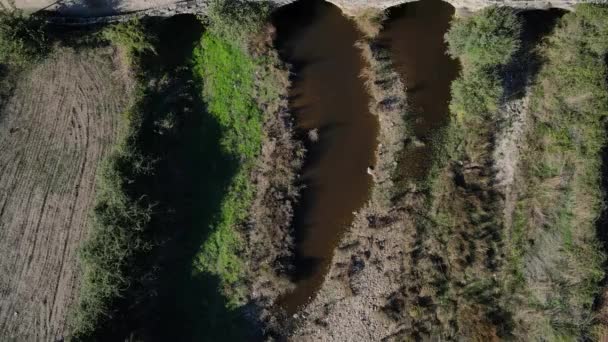 Drone Pushes Ancient Roman Bridge Showing Drying River Farmland — Stok video