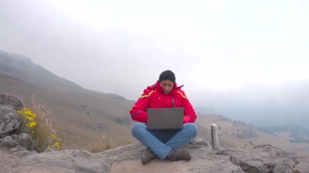 Young Man Sitting Rock Using Laptop Drink Coffe — Stockvideo