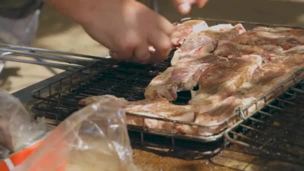 Man Placing Meat Braai Barbeque — 图库视频影像