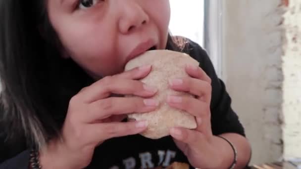 Vegan Girl Eating Take Big Bite Veggie Burrito — 图库视频影像
