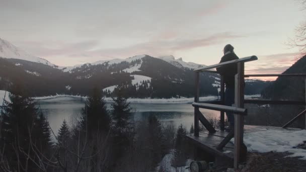 Millennial Young Male Traveler Looking Out Winter Landscape Arms Wide — Video