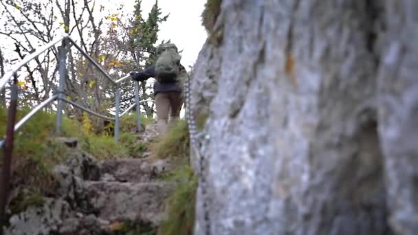 Slow Motion Backpacker Hiking Stone Rock Steps Holding Handrail — Vídeo de stock