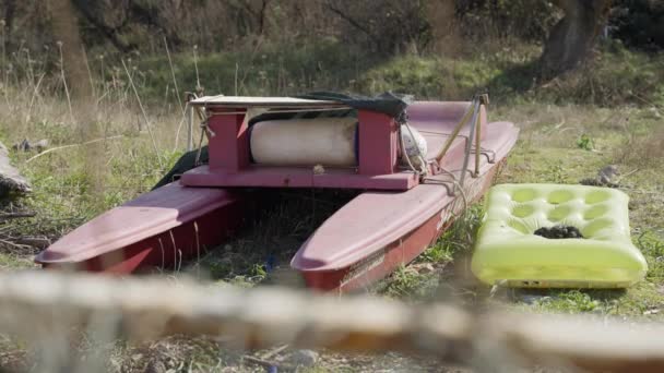 Abandoned Red Catamaran Left Side Yellow Air Mattress Next Nature — Vídeo de stock