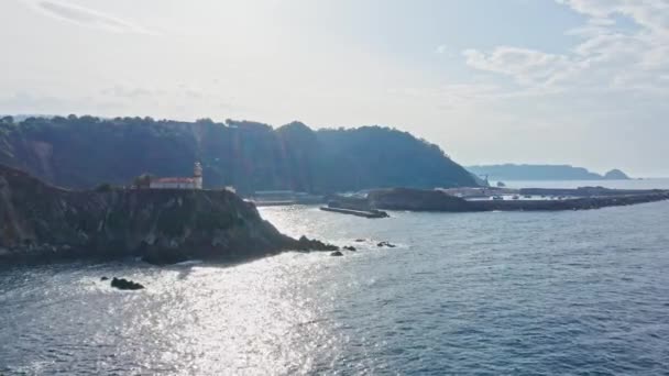 Cudillero Coastline Lighthouse Harbor Seascape Sunlight Glare Water Surface Aerial — Video