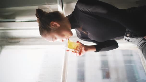 Young Woman Sitting Windowsill Enjoying Drink While Looking Sunny Afternoon — Stock video