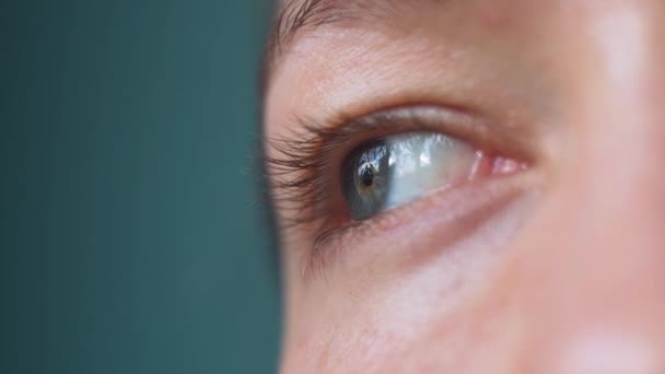 Close Woman Eye While She Looks Window Thoughtfully Daytime — Video