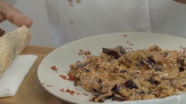 Large Loaf Bread Being Smeared Vegetable Stuffing — Stock video