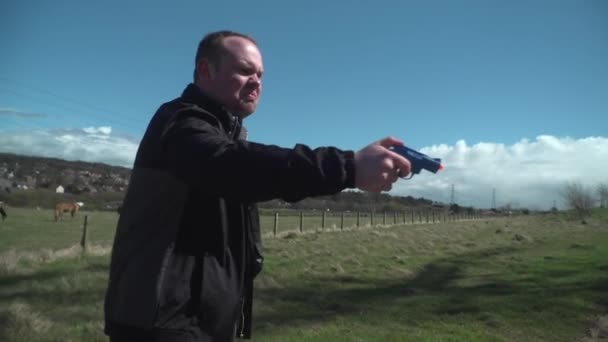 Angry Man Yelling Waving Toy Pistol Offscreen — Stock video