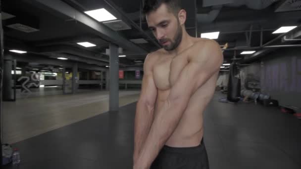 Young Athletic Man Stretching Arms Doing Exercise Gym — Stockvideo