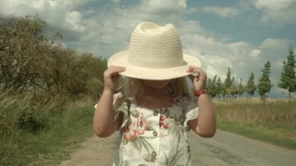 Little Girl Playing Big Hat — Vídeos de Stock