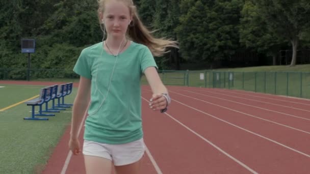 Teen Girl Walks High School Track Smiling Herself Slow Motion — Vídeos de Stock