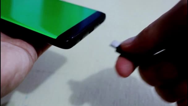 Plugging Phone Charger Green Screen — Stockvideo