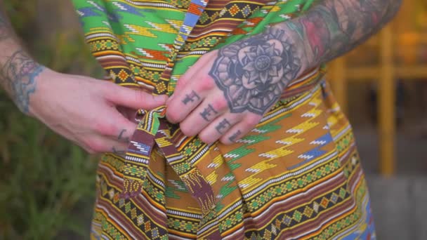 Close Shot Caucasian Male Hands Taking His Native Tropical Robe — Stockvideo