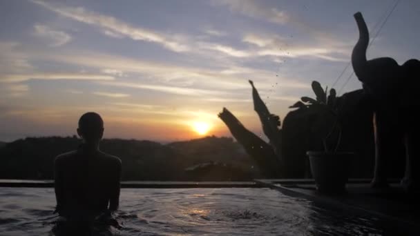 Medium Shot Female Silhouette Infinity Pool Looking Horizon Sunset — Video