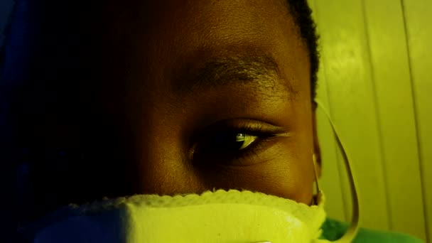 Close African Boy Sad Eyes Wearing Medical Mask — Stockvideo