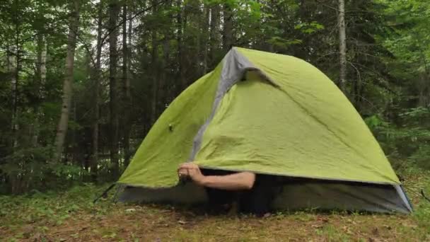 Man Getting Out Small Camping Tent Door — Vídeo de stock