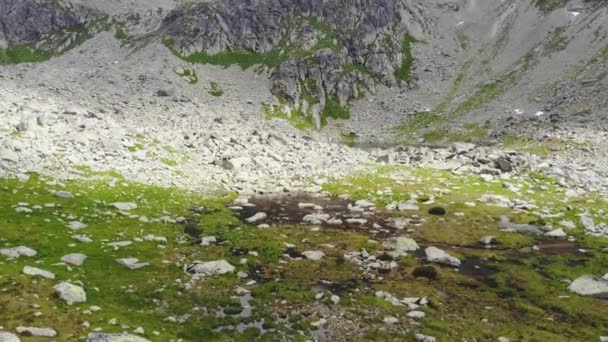 Aerial Slowly Flying Puddle Water Mountain — Stockvideo