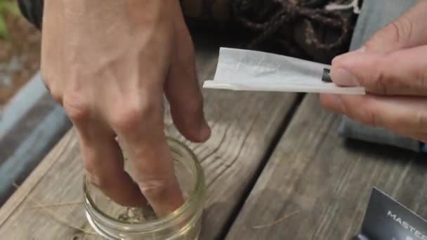 Close Man Hands Putting Grinded Cannabis Cigarette Paper — 图库视频影像