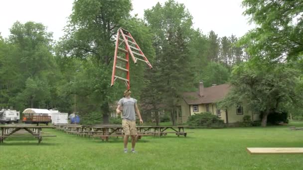 Man Balances Six Foot Ladder His Chin Amazing Skill Slow — Videoclip de stoc