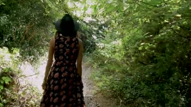 Young Woman Walks Narrow Path Dense Wood — Vídeo de Stock