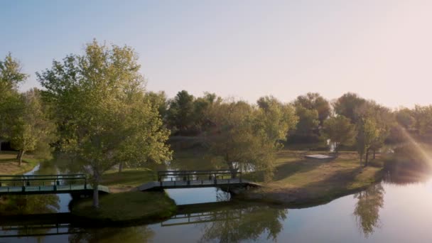 Aerial Pan Bridges Apollo Park Lake Golden Hour Lancaster California — 图库视频影像