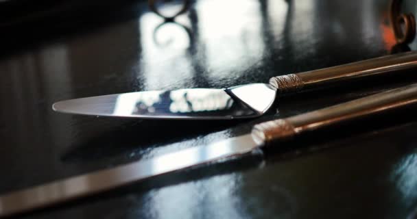 Polished Cake Knife Black Reflective Wedding Table — Video Stock