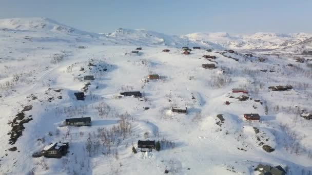 Aerial View Showing Many Houses Half Buried Snow Barren Mountainous — Vídeos de Stock