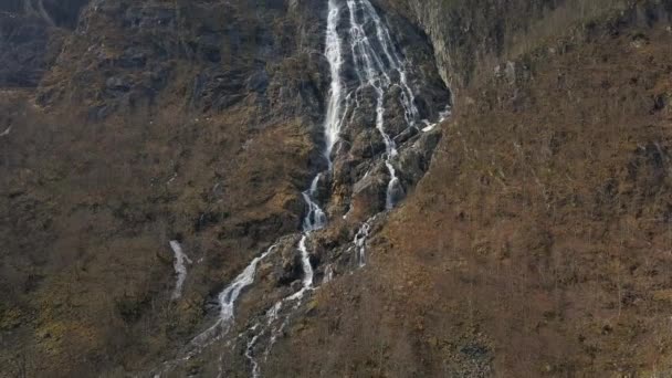 Aerial Tilt Shot Incredible Waterfall Cascading Mountain Norway Snow Melts — Stockvideo