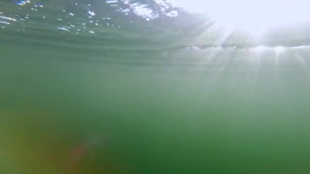 Pov Shot Male Swimmimng Underwater Air Bubbles Light Rays Slowmotion — Stockvideo
