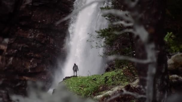 Man Standing Front Huge Waterfall Slow Motion Shot Beautiful Location — Video Stock