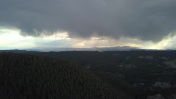 Aerial View Storm Clouds Looming Distance Forested Mountains Colorado Tilt — Video