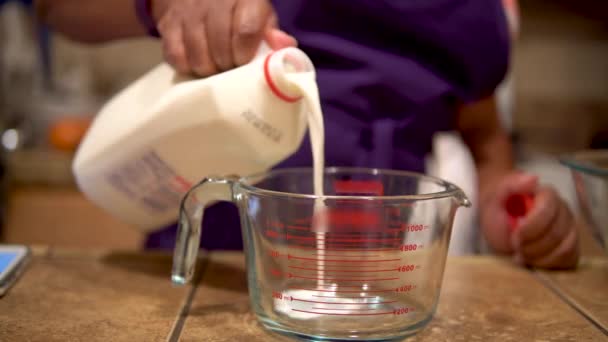 Woman Pouring Milk Measuring Cup Home Kitchen Close — Vídeo de Stock