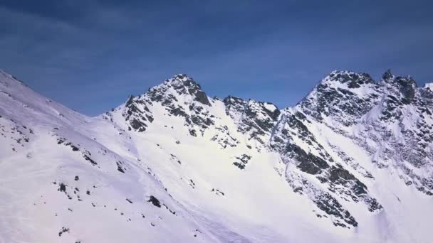 Aerial Drone Shot Flying Bright White Snow Mountains Covered Clouds — Stockvideo