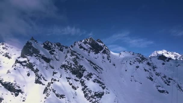 Aerial Drone Shot Dark Rocky Mountain Peaks Covered White Snow — 图库视频影像