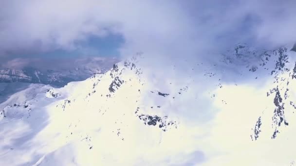 Aerial Drone Shot Bright White Snow Mountains Covered Clouds Ski — Stock video