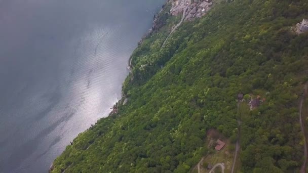 Aerial Drone Shot Large Misty Blue Lake Next Town Buildings — Vídeo de Stock