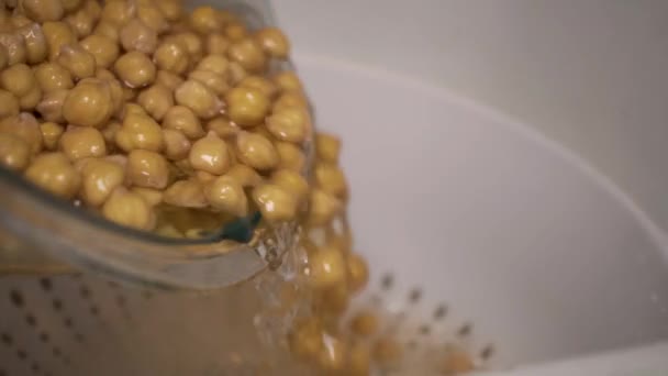 Pouring Soaked Chick Peas Water White Colander Strainer — ストック動画