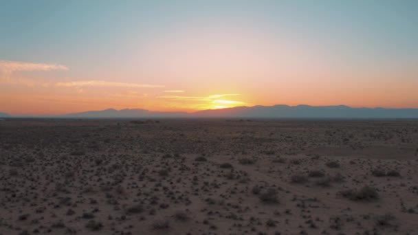 Flying Backward Mojave Desert Plain Colorful Sunset Aerial — Stockvideo