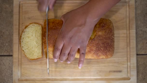 African American Woman Slicing Homemade Bread Overhead Close Hands — Vídeo de Stock