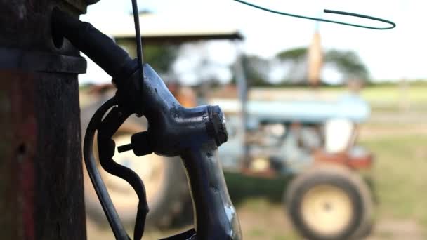 Well Weathered Fuel Nozzle Hanging Antique Fuel Pump Old Blurred — Stockvideo