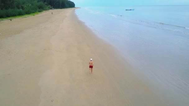 Drone View Man Running Perfect Beach Boat Background — Stockvideo