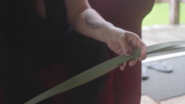 Woman Prepping Plant Leaves Weave Basket — Stok video