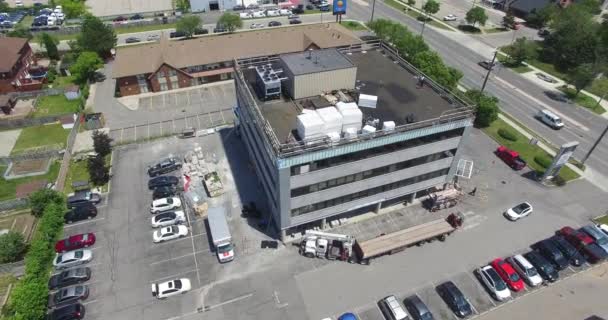 Drone Circling Large Industrial Building Construction — стоковое видео