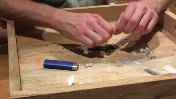 Front View Man Adding Marijuana Tobacco Wooden Tray Comfort His — Stok video