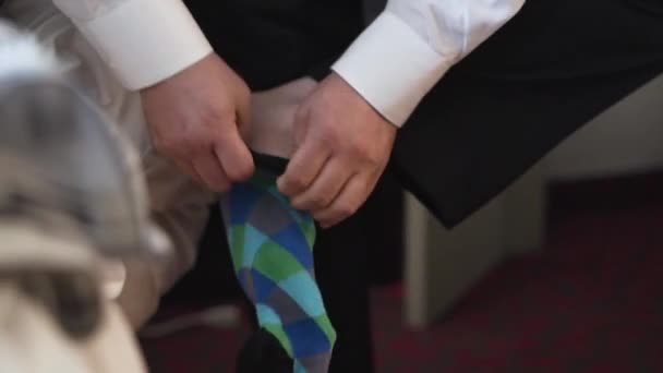 Groom Putting Colourful Sock Slow Motion — Stockvideo