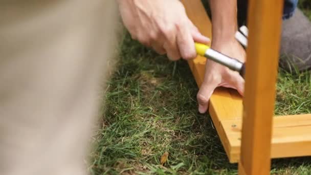 Construction Worker Hammering Nail Piece Wood — Stock Video